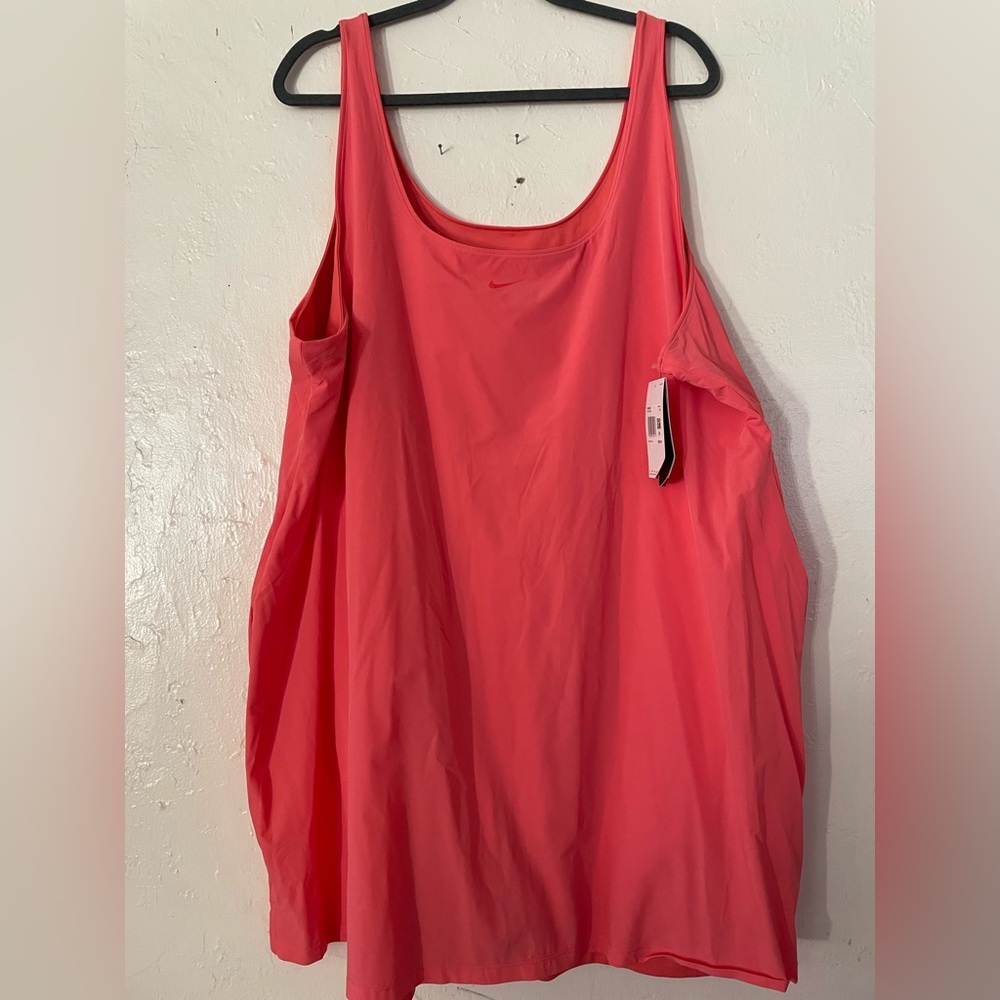 Nike 3x sport dress with built in shorts. NWT coral color